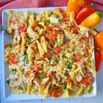 Cajun Louisiana Chicken Pasta made with onions, peppers, chicken, and cajun cream tossed with your favorite kind of pasta and topped with parmesan cheese and pine nuts. A super flavorful creamy pasta dish. www.modernhoney.com