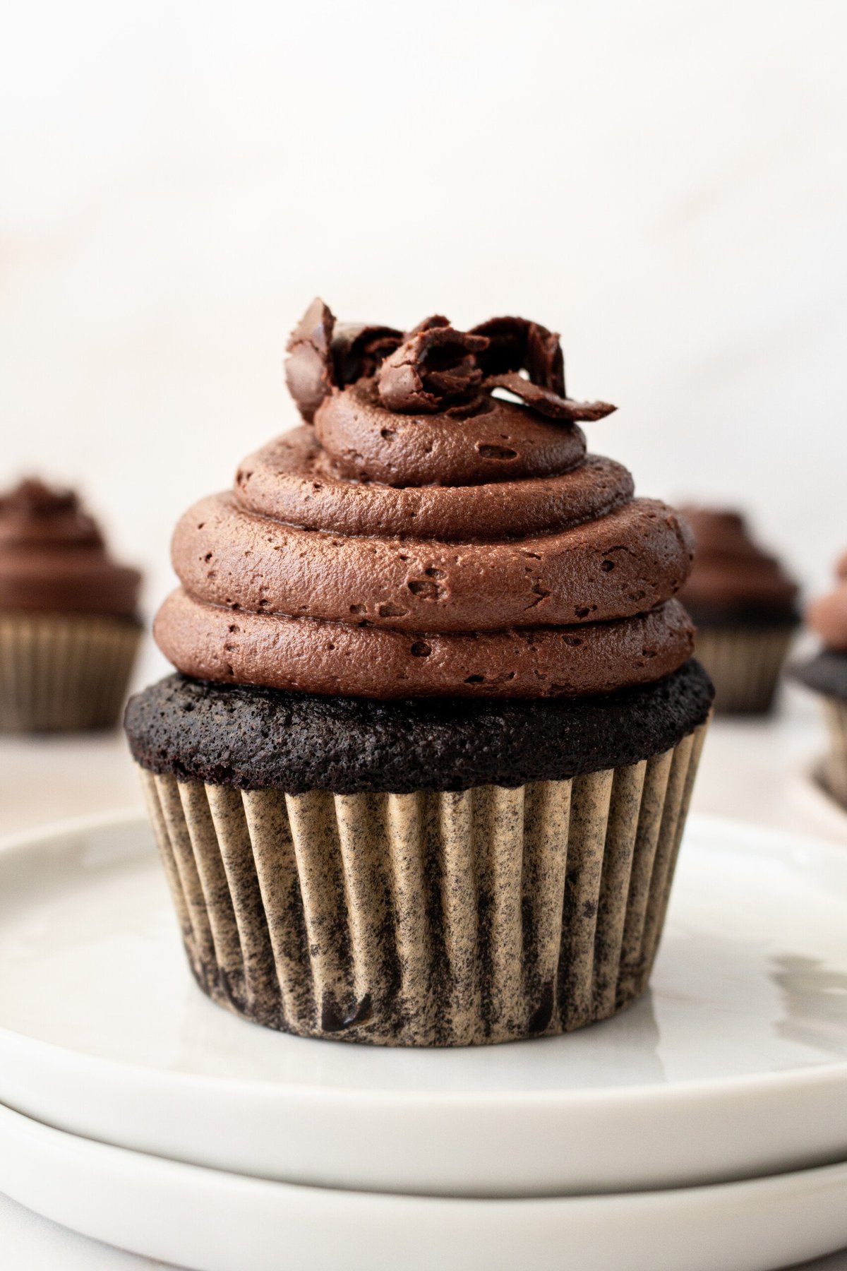 This is the Ultimate Chocolate Cupcake Recipe, with a rich, moist chocolate cake with a tender crumb and a velvet chocolate frosting. These are the best chocolate cupcakes you'll ever taste, with a deep cocoa flavor that melts in your mouth. Not only are they delicious, but this easy chocolate cupcake recipe takes just minutes to prepare. If you are looking for moist chocolate cupcakes that are 5-star rated, this is the recipe for you!