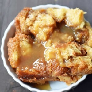 Salted Caramel Bread Pudding made with brioche or challah bread and baked in half-n-half, eggs, brown sugar, and vanilla. This heavenly caramel bread pudding is topped with a homemade sea salt caramel sauce. www.modernhoney.com