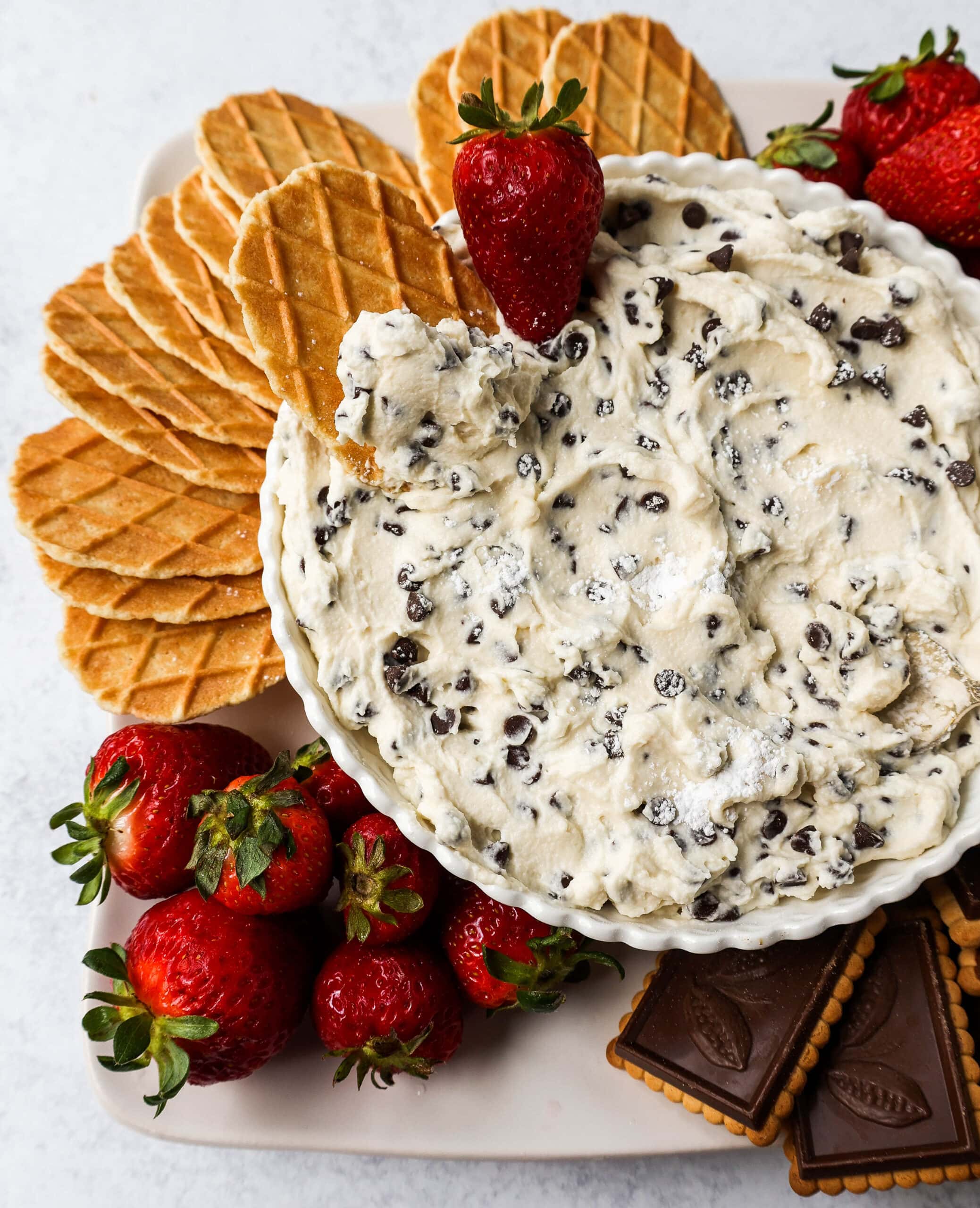 This is the Best Cannoli Dip Recipe made with ricotta cheese, mascarpone or cream cheese, powdered sugar, brown sugar, vanilla, and mini chocolate chips. 