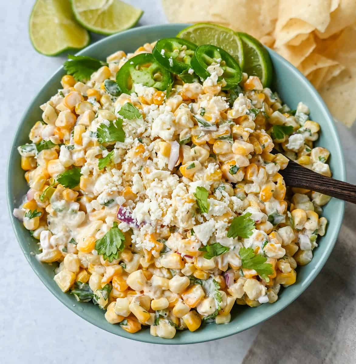 Inspired by Mexican street corn, this dip is made with sweet roasted corn and mixed with red onion, cilantro, jalapeño, lime juice, mexican spices, a touch of mayo, and cotija cheese.