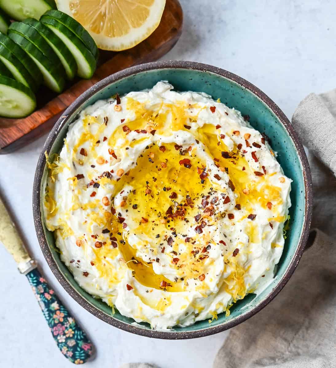 Simple and creamy whipped feta cheese dip is the perfect appetizer! Mediterranean feta cheese is whipped with cream cheese, olive oil, lemon zest, and warm spices. Fresh and tangy, it pairs perfectly with pita bread and veggies!