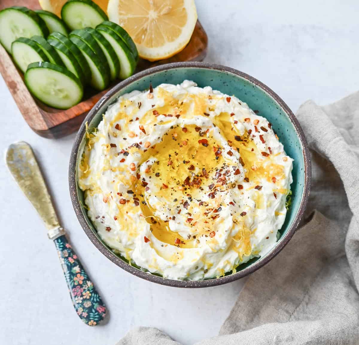Simple and creamy whipped feta cheese dip is the perfect appetizer! Mediterranean feta cheese is whipped with cream cheese, a touch of mayo, lemon zest, and warm spices. Fresh and tangy, it pairs perfectly with warm pita bread and veggies!