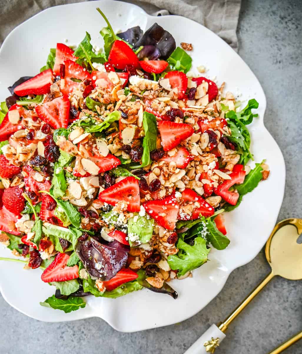 Strawberry Spring Mix Salad. This Strawberry Poppyseed Salad is made with spring mix, fresh strawberries, creamy and tangy feta cheese, sugared almonds, and tossed with a sweet homemade poppyseed dressing. 