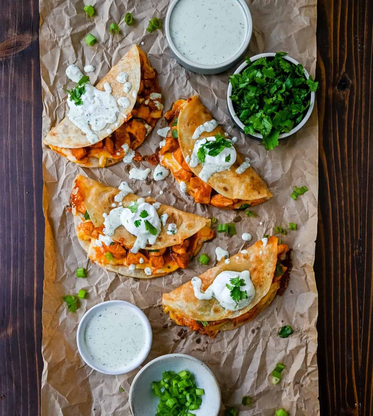 These Crispy Buffalo Chicken Tacos with Jalapeno Ranch Dressing are made with spicy buffalo chicken, melted cheese, drizzled with a homemade cilantro jalapeno ranch. Whether you’re hosting a game day party, preparing a family dinner, or looking for a fun and flavorful meal, these buffalo chicken tacos are a hit!