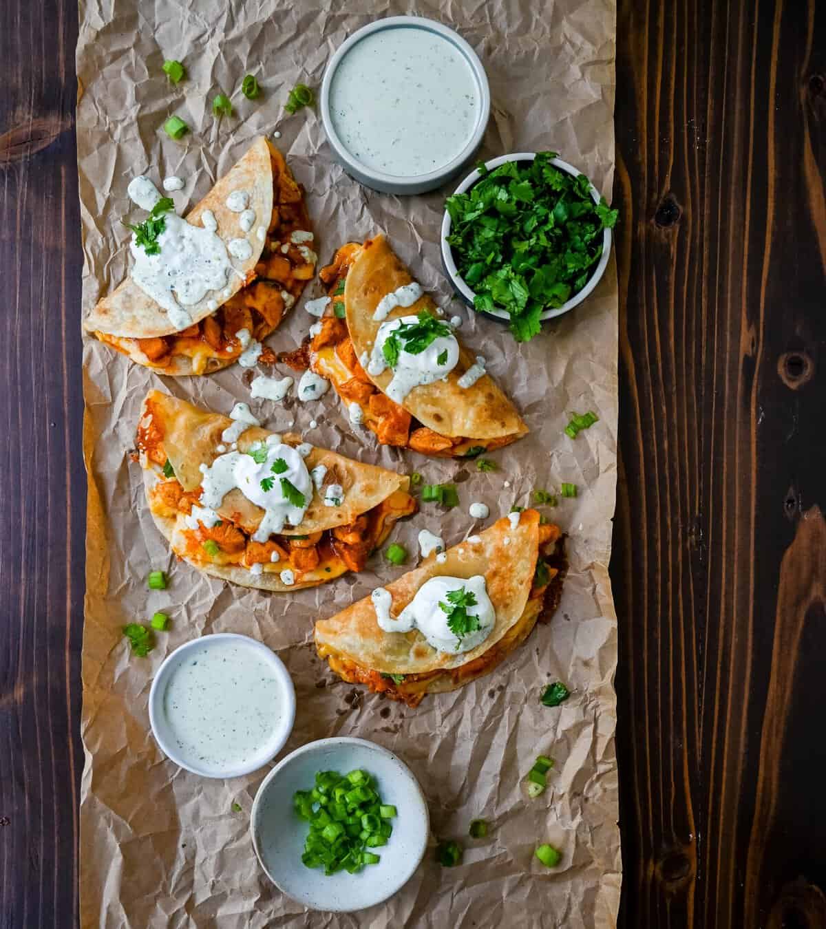 These Crispy Buffalo Chicken Tacos with Jalapeno Ranch Dressing are made with spicy buffalo chicken, melted cheese, drizzled with a homemade cilantro jalapeno ranch. Whether you’re hosting a game day party, preparing a family dinner, or looking for a fun and flavorful meal, these buffalo chicken tacos are a hit!