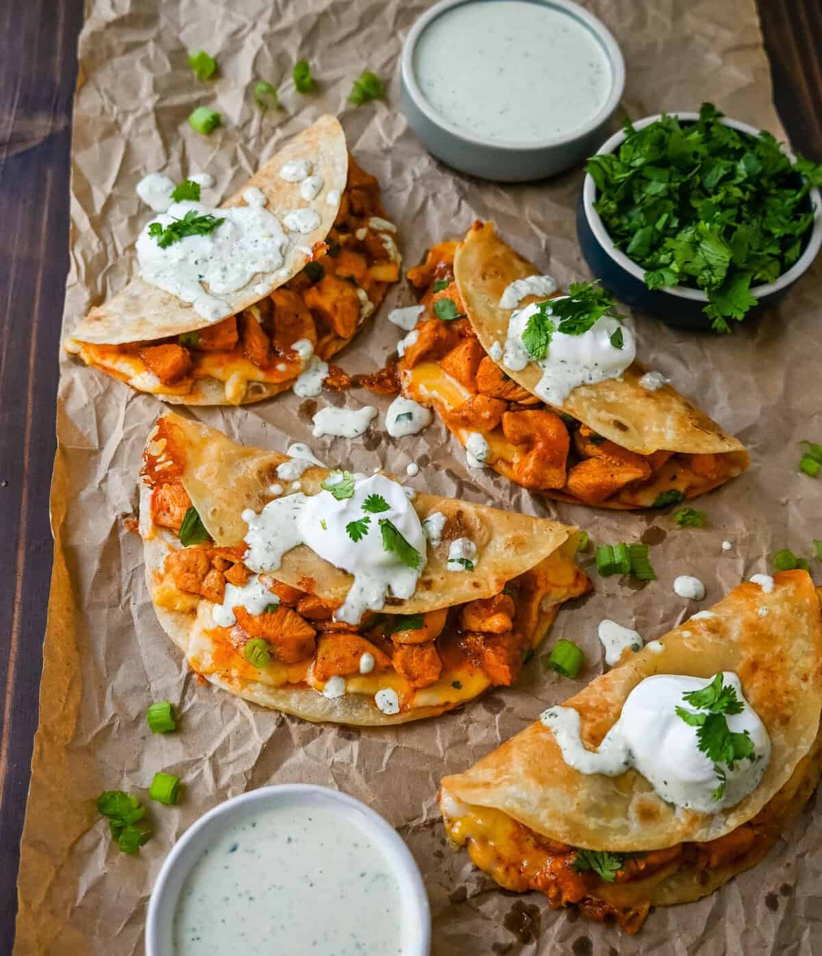 These Crispy Buffalo Chicken Tacos with Jalapeno Ranch Dressing are made with spicy buffalo chicken, melted cheese, drizzled with a homemade cilantro jalapeno ranch. Whether you’re hosting a game day party, preparing a family dinner, or looking for a fun and flavorful meal, these buffalo chicken tacos are a hit!