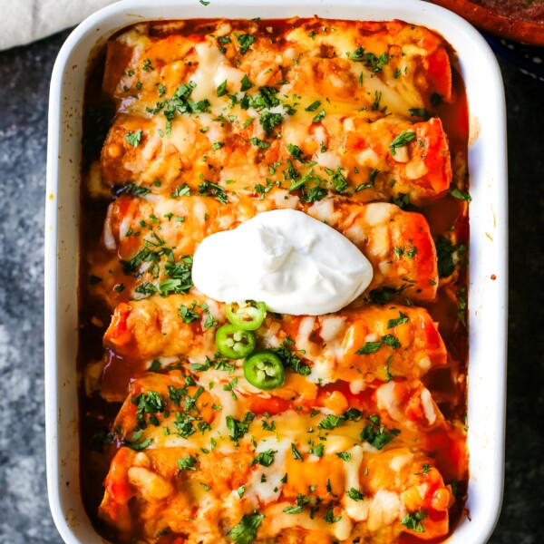 How to make Quick and Easy Chicken Enchiladas with only a few ingredients. This delicious chicken enchiladas recipe is super simple and a crowd pleaser.