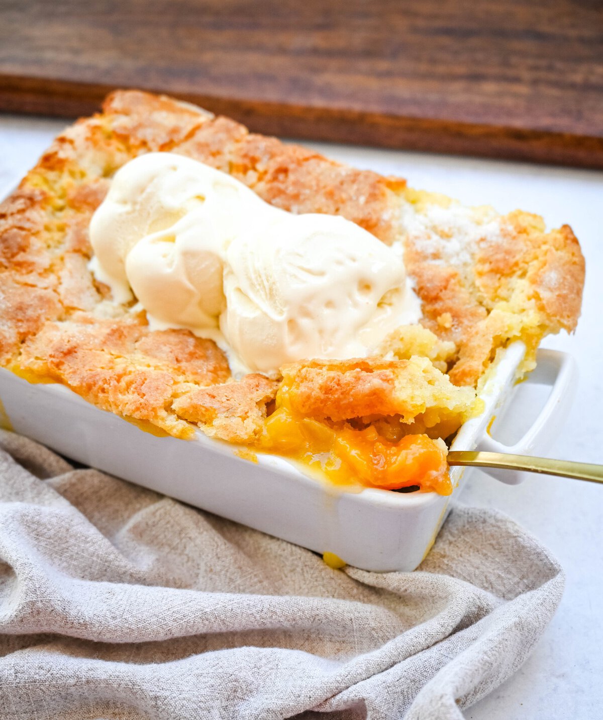 This Homemade Nectarine Cobbler is made with fresh nectarines tossed in sugar and topped with a golden, buttery crust and served warm with vanilla bean ice cream. This is the best nectarine cobbler recipe!