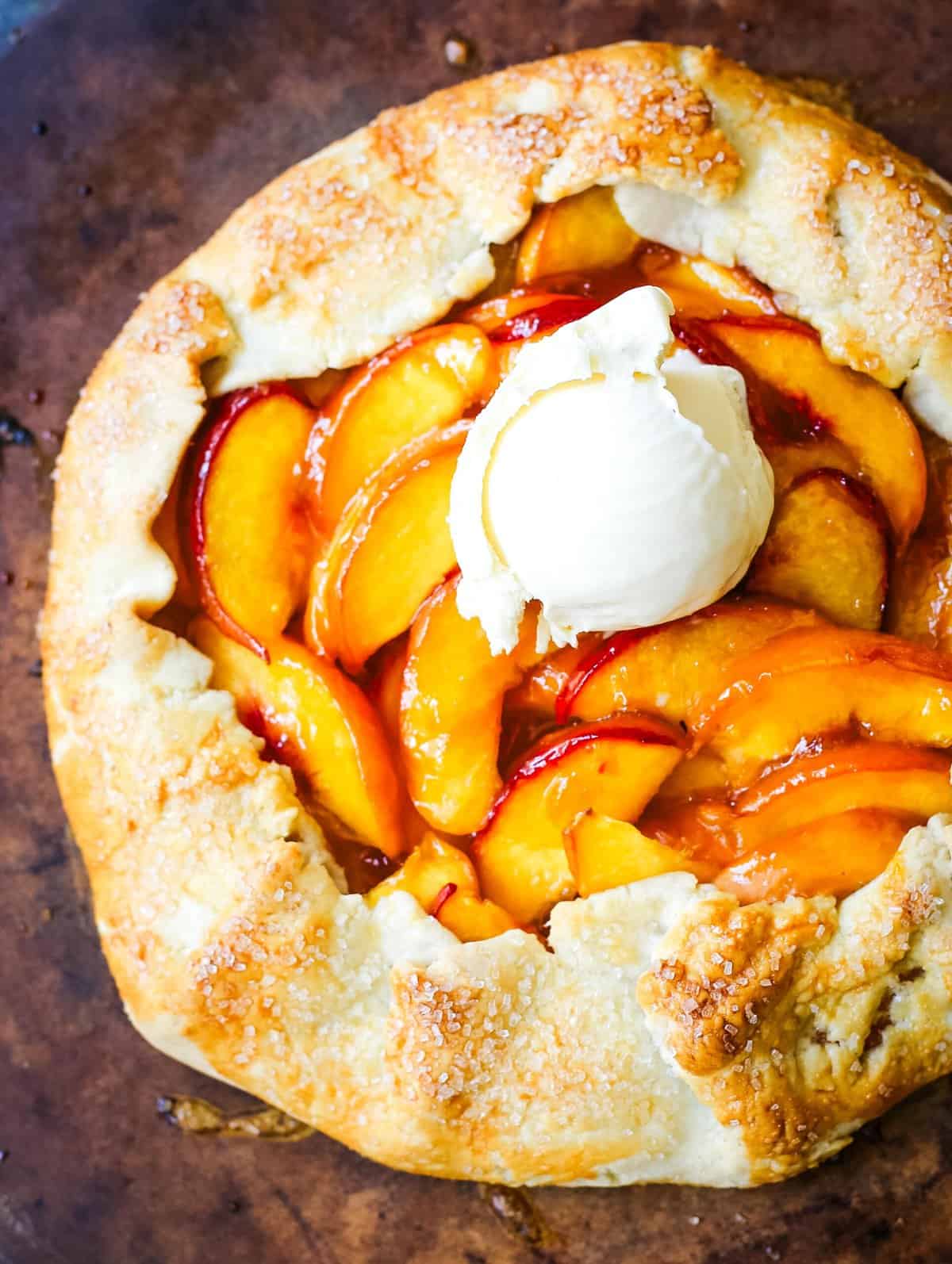 This Homemade Peach Galette is made with a warm, golden crust that's both buttery and flaky and filled with juicy, sweetened, sun-ripened peaches and baked until perfection. This is the perfect summer dessert recipe!