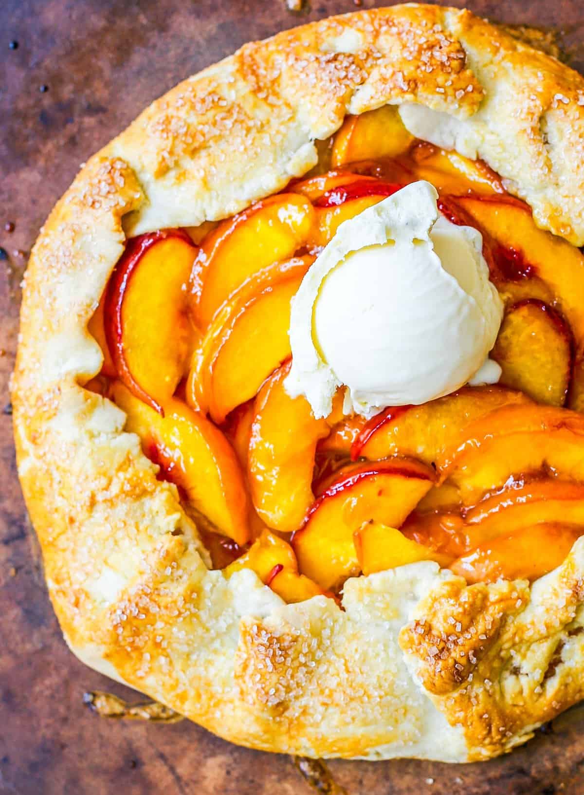 This Homemade Peach Galette is made with a warm, golden crust that's both buttery and flaky and filled with juicy, sweetened, sun-ripened peaches and baked until perfection. This is the perfect summer dessert recipe!