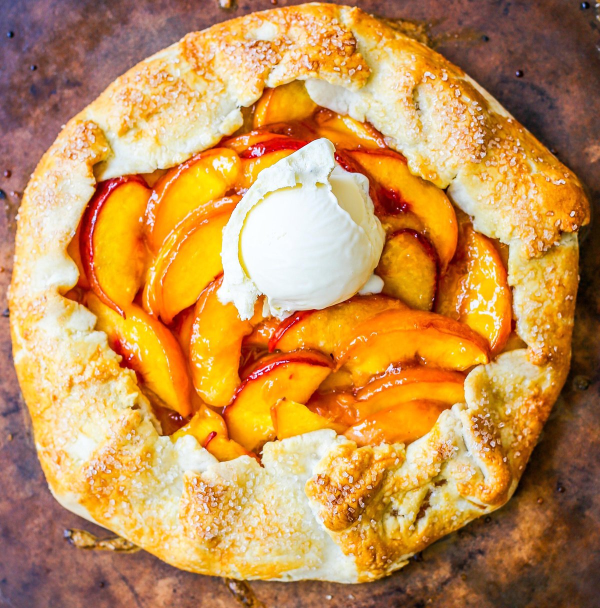 This Homemade Peach Galette is made with a warm, golden crust that's both buttery and flaky and filled with juicy, sweetened, sun-ripened peaches and baked until perfection. This is the perfect summer dessert recipe!