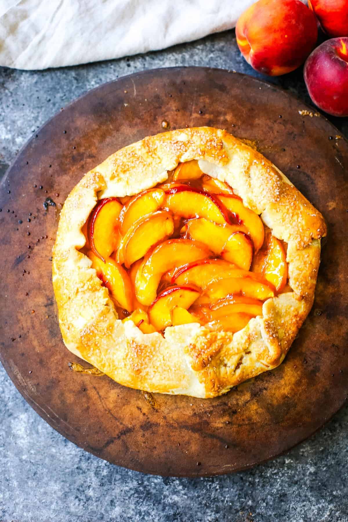 This Homemade Peach Galette is made with a warm, golden crust that's both buttery and flaky and filled with juicy, sweetened, sun-ripened peaches and baked until perfection. This is the perfect summer dessert recipe!