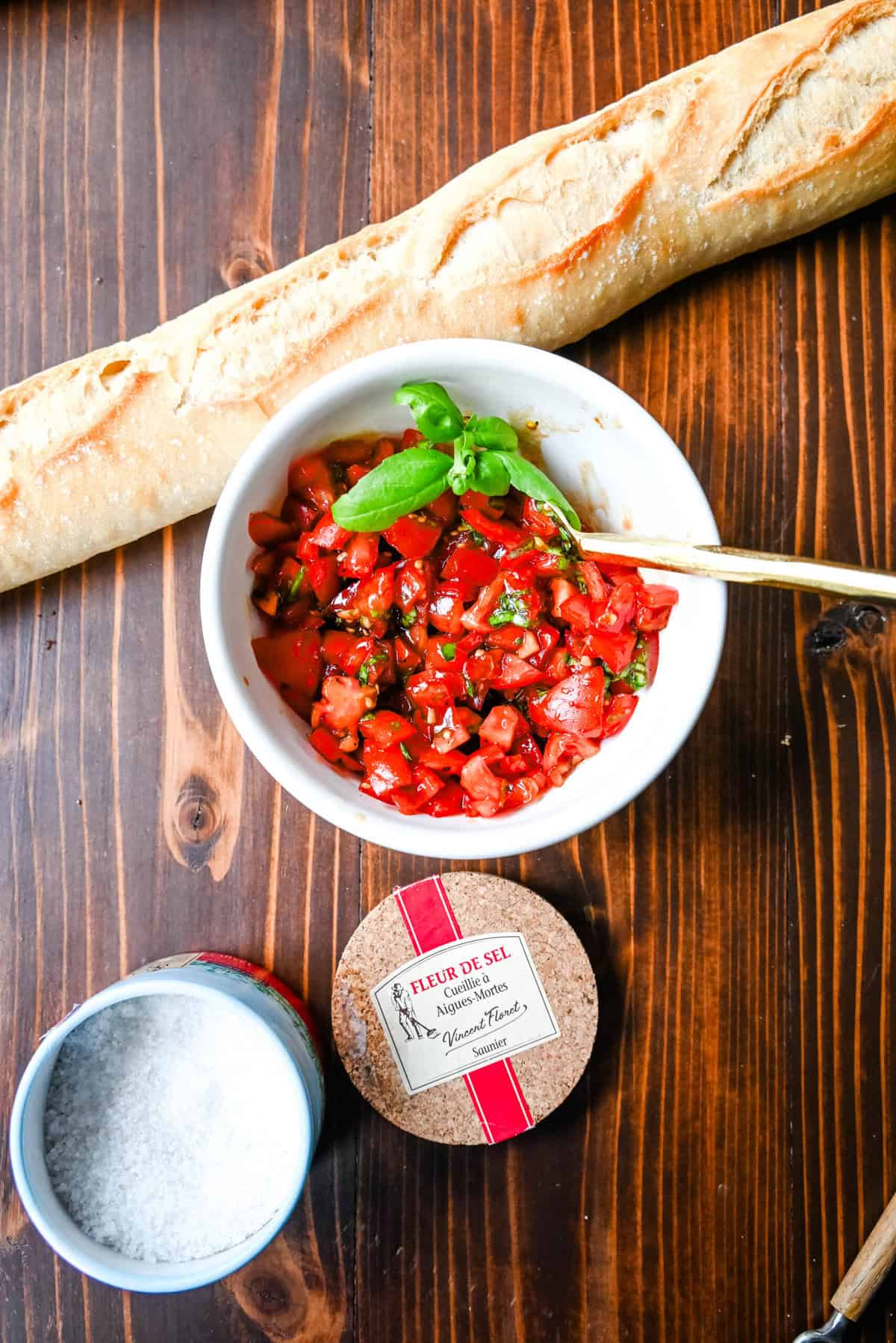 This quick and easy appetizer is made with garlic and herb Boursin cheese and topped with a fresh caprese salad made with tomatoes, olive oil, balsamic glaze, basil, and garlic. This Caprese Dip with boursin cheese pairs perfectly with crostinis or crackers.