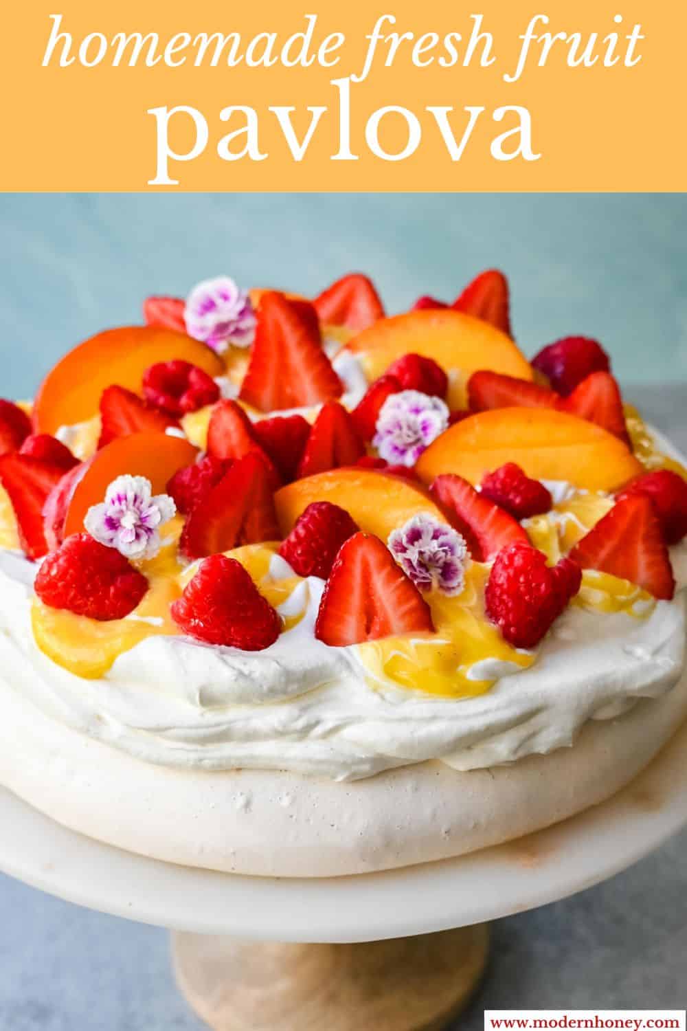 Pavlova is a stunning and elegant dessert with a crisp, crunchy outer shell with a soft, marshmallow-like center and topped with fresh whipped cream and fresh fruit. This homemade pavlova is a beautiful and delicious dessert.