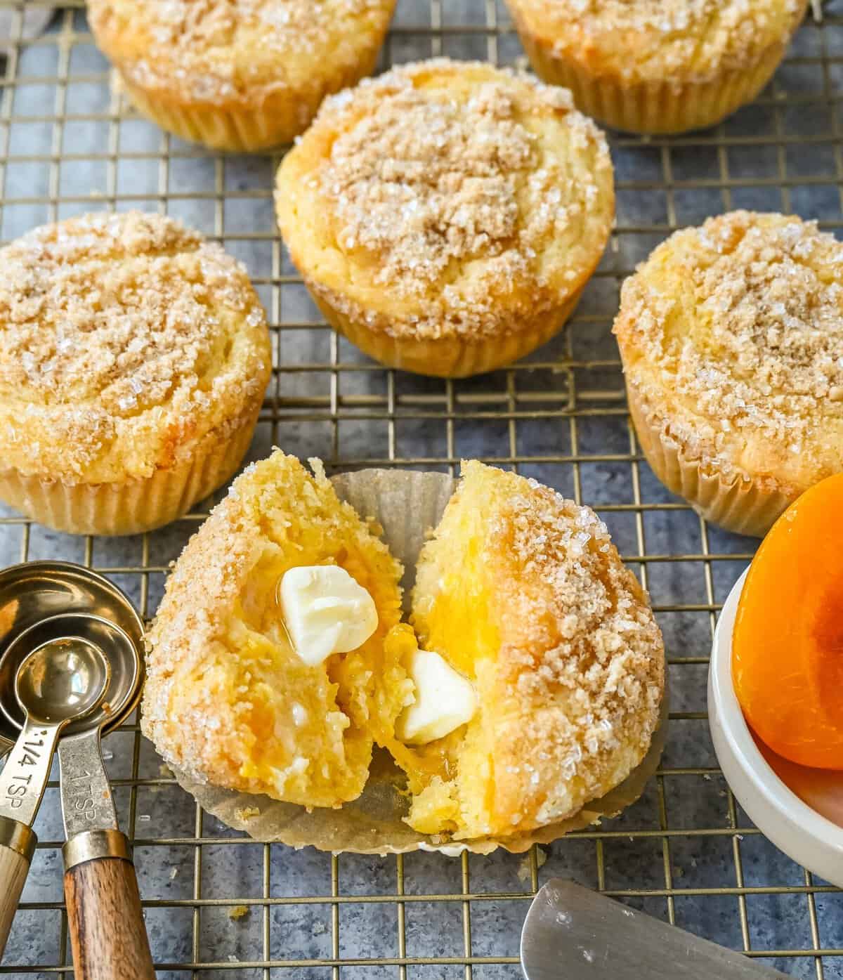 These Peach Cobbler Muffins are made with fresh, juicy peaches topped with a buttery streusel topping. These peach muffins are tender, moist, and bursting with fresh peach flavor and the sweetness of white chocolate chips.