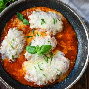 Skinny Chicken Parmesan is a healthier, lower fat version of chicken parmesan. Non-breaded chicken in a robust tomato sauce with creamy mozzarella cheese. A simple, easy, flavorful chicken dish!