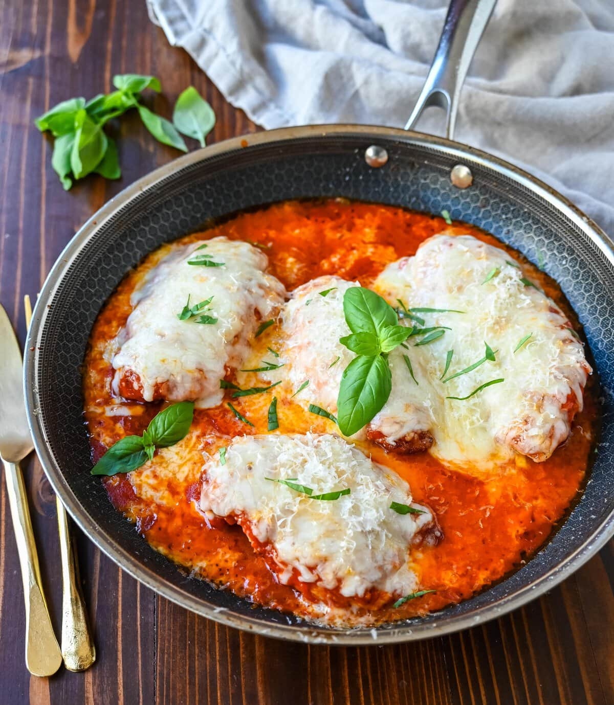 Skinny Chicken Parmesan is a healthier, lower fat version of chicken parmesan. Non-breaded chicken in a robust tomato sauce with creamy mozzarella cheese. A simple, easy, flavorful chicken dish!