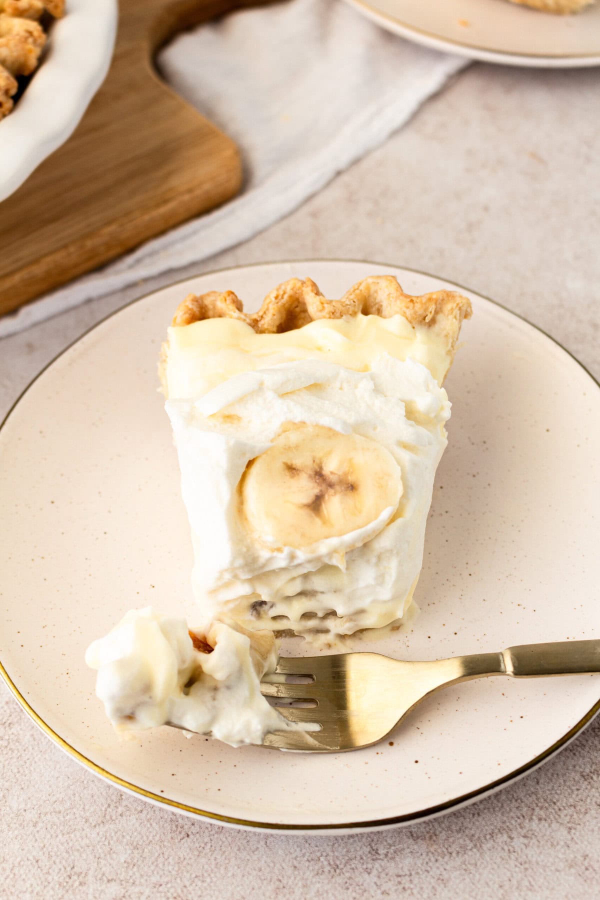 Taking a bite of homemade banana cream pie. This is an easy banana cream pie recipe.