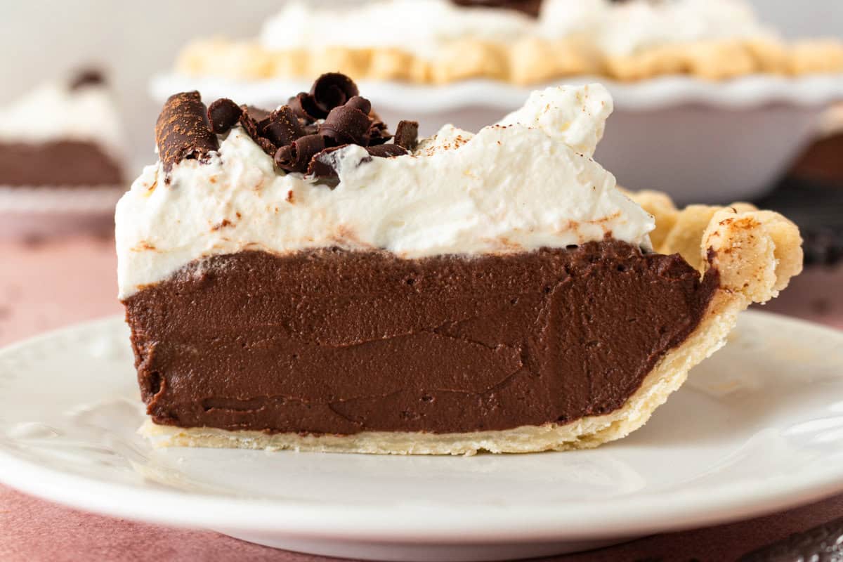 This is the best Chocolate Cream Pie recipe made with decadent chocolate custard in a flaky, buttery crust and topped with homemade whipped cream and chocolate shavings. You will love this chocolate pie recipe!