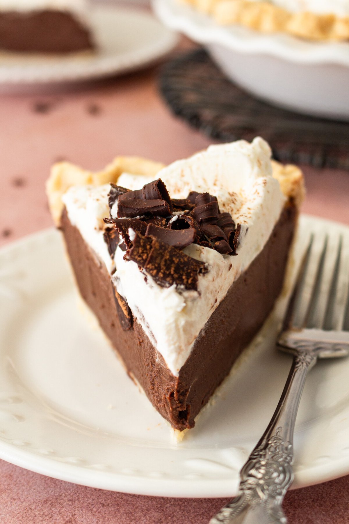 This is the best Chocolate Cream Pie recipe made with decadent chocolate custard in a flaky, buttery crust and topped with homemade whipped cream and chocolate shavings. You will love this chocolate pie recipe!