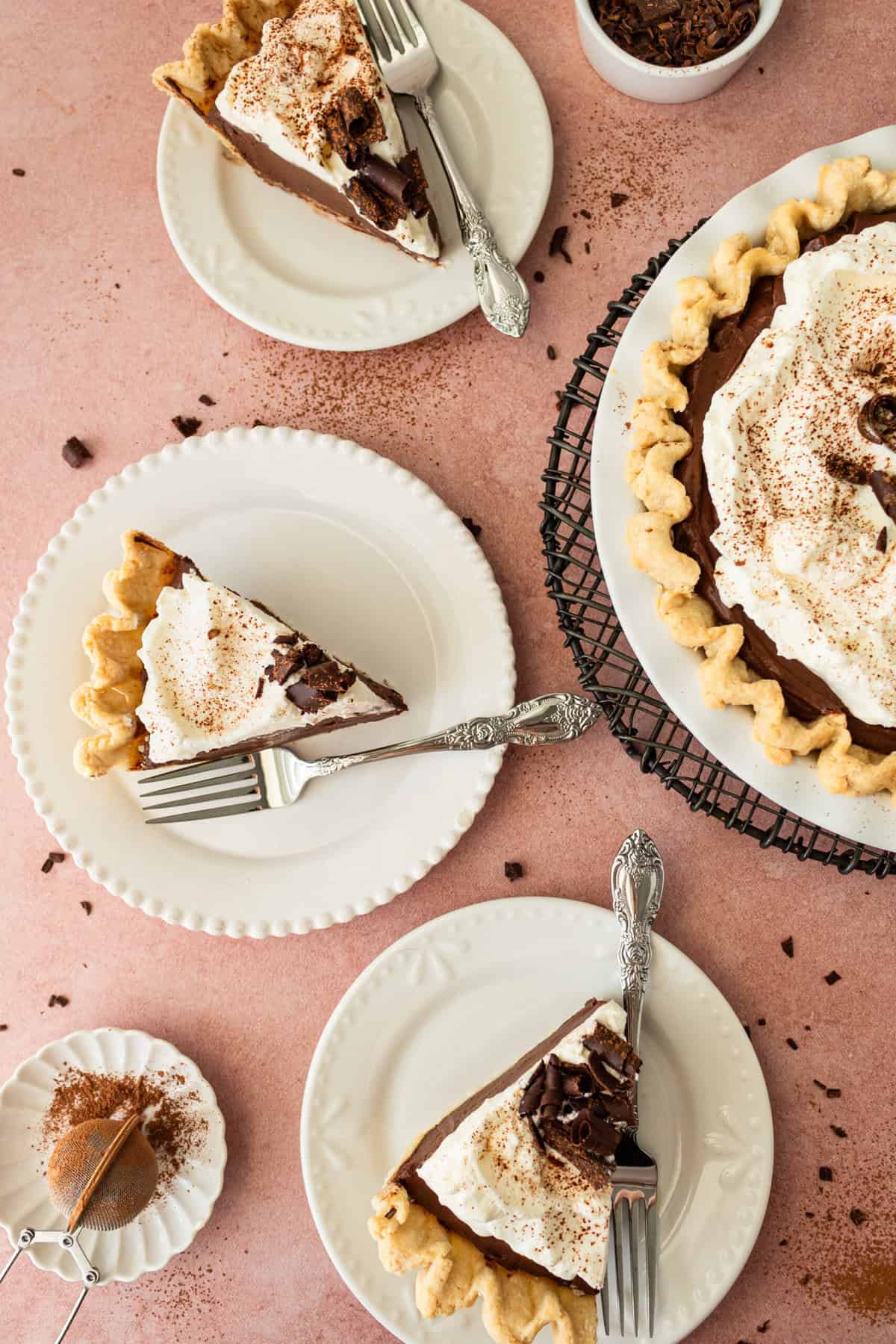 This is the best Chocolate Cream Pie recipe made with decadent chocolate custard in a flaky, buttery crust and topped with homemade whipped cream and chocolate shavings. You will love this chocolate pie recipe! 