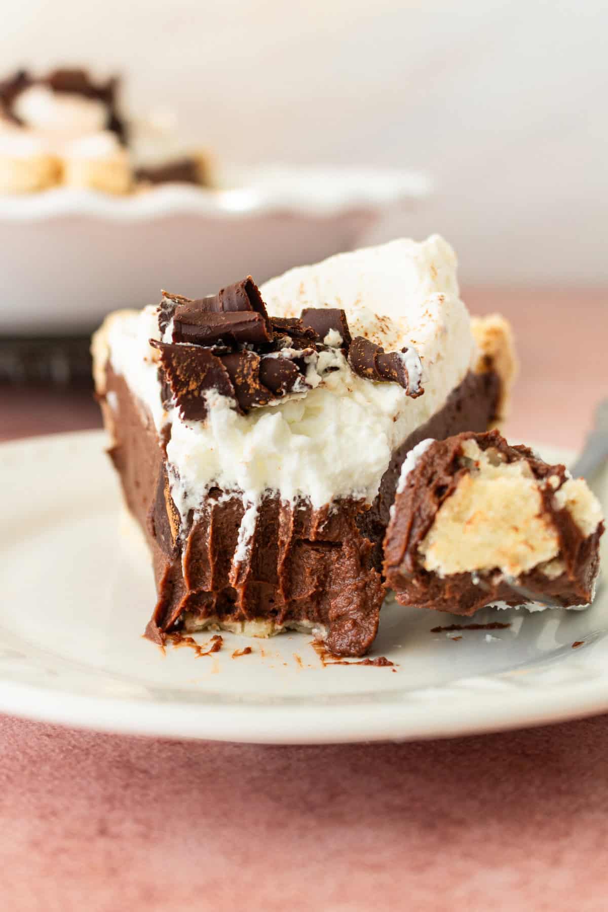 This is the best Chocolate Cream Pie recipe made with decadent chocolate custard in a flaky, buttery crust and topped with homemade whipped cream and chocolate shavings. You will love this chocolate pie recipe! 