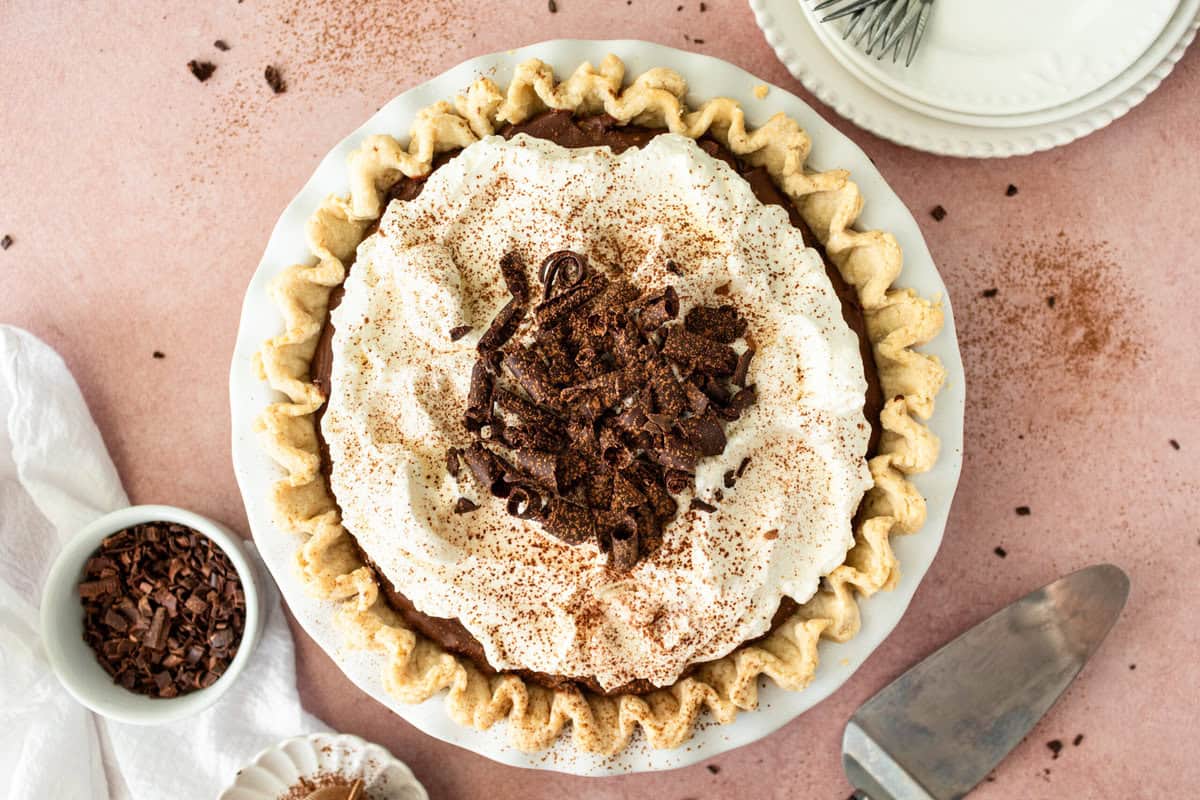 This is the best Chocolate Cream Pie recipe made with decadent chocolate custard in a flaky, buttery crust and topped with homemade whipped cream and chocolate shavings. You will love this chocolate pie recipe!