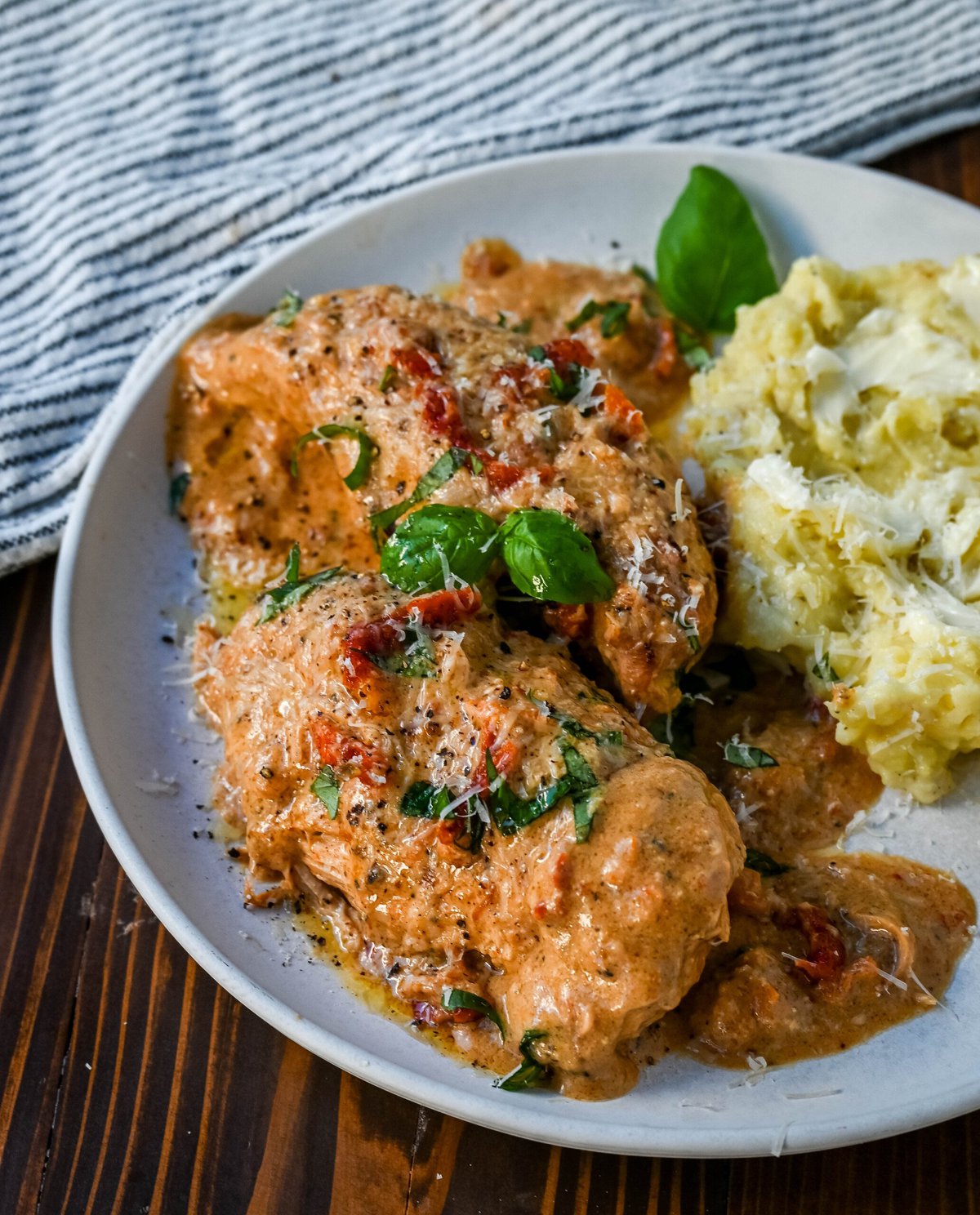 Crockpot Marry Me Chicken is a deliciously rich and creamy dish that is bursting with flavor. This slow cooker Marry Me Chicken is made with tender chicken simmers in a sauce made with garlic, sun-dried tomatoes, and Parmesan, creating a savory blend of tangy, herby, and cheesy goodness. The creamy sauce, with hints of sweetness from the sun-dried tomatoes and a touch of spice, coats every bite, making it irresistible.