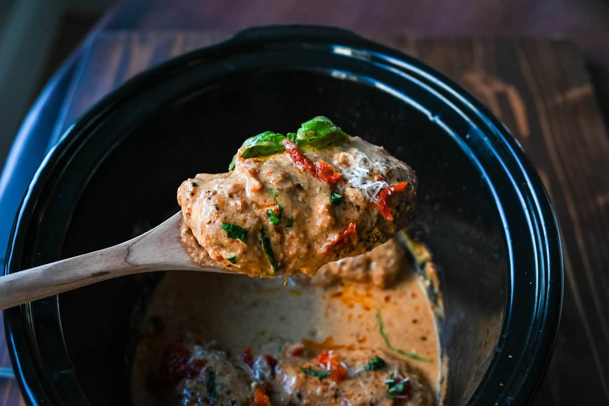 Crockpot Marry Me Chicken is a deliciously rich and creamy dish that is bursting with flavor. This slow cooker Marry Me Chicken is made with tender chicken simmers in a sauce made with garlic, sun-dried tomatoes, and Parmesan, creating a savory blend of tangy, herby, and cheesy goodness. The creamy sauce, with hints of sweetness from the sun-dried tomatoes and a touch of spice, coats every bite, making it irresistible.