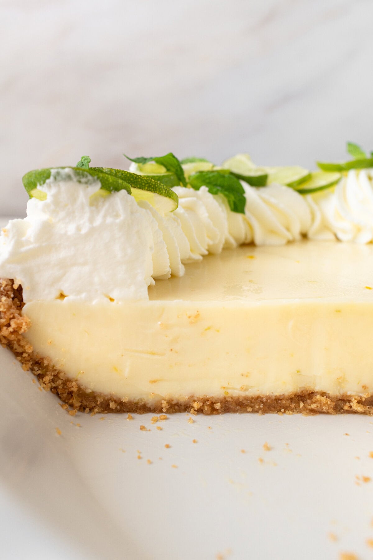 Learn how to make the best key lime pie with a perfectly sweet and buttery graham cracker crust. This easy key lime pie recipe features fresh key lime juice for a tangy, refreshing filling, balanced with the sweetness of condensed milk. Ideal for summer gatherings or as a classic dessert, follow our step-by-step guide to create this homemade key lime pie that everyone will love!