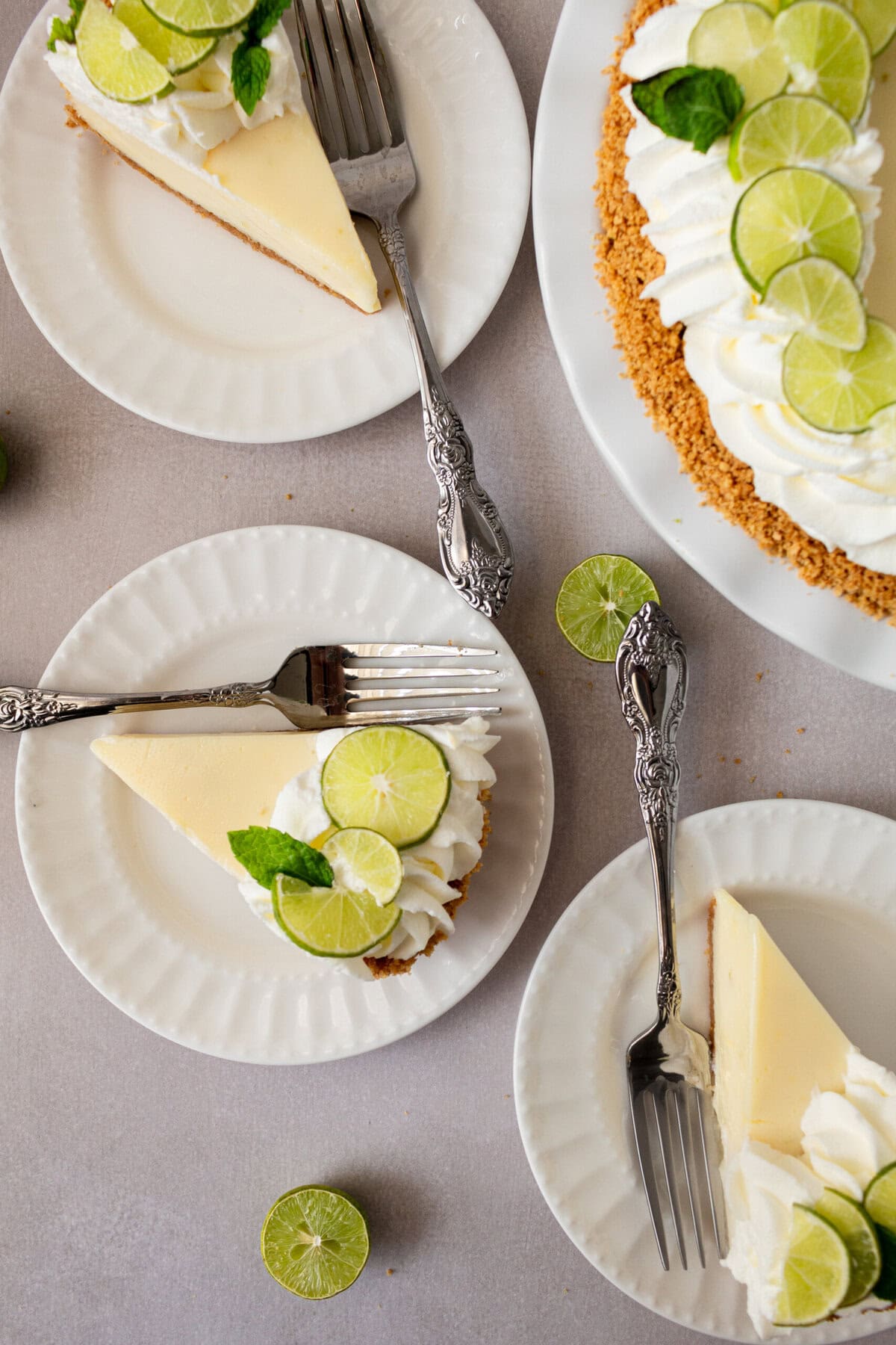 Learn how to make the best key lime pie with a perfectly sweet and buttery graham cracker crust. This easy key lime pie recipe features fresh key lime juice for a tangy, refreshing filling, balanced with the sweetness of condensed milk. Ideal for summer gatherings or as a classic dessert, follow our step-by-step guide to create this homemade key lime pie that everyone will love! Key Lime Pie with graham cracker crust and whipped cream.