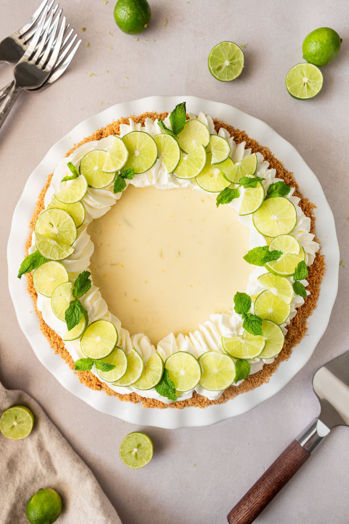 Learn how to make the best key lime pie with a perfectly sweet and buttery graham cracker crust. This easy key lime pie recipe features fresh key lime juice for a tangy, refreshing filling, balanced with the sweetness of condensed milk. Ideal for summer gatherings or as a classic dessert, follow our step-by-step guide to create this homemade key lime pie that everyone will love!