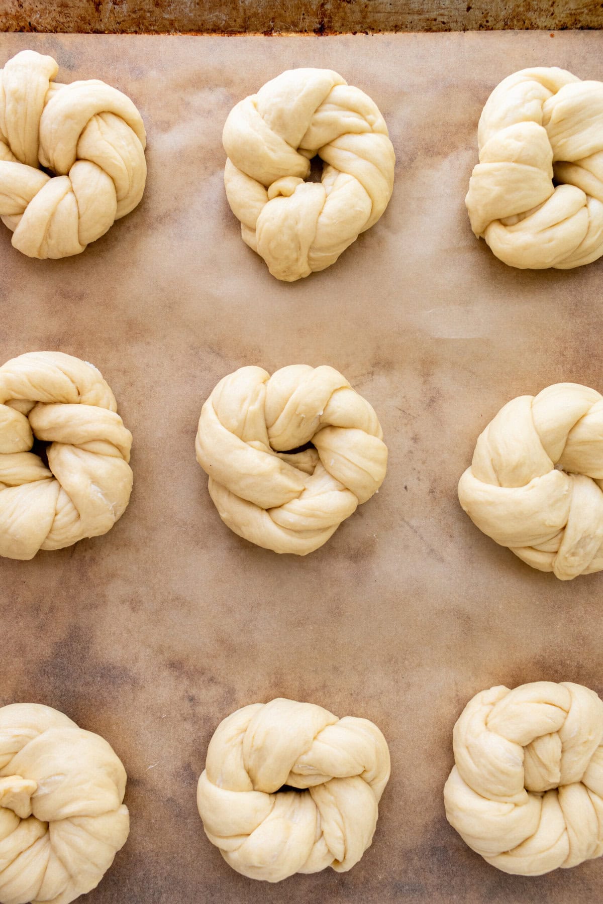 Knotted Rolls on baking sheet ready to be baked in the oven.