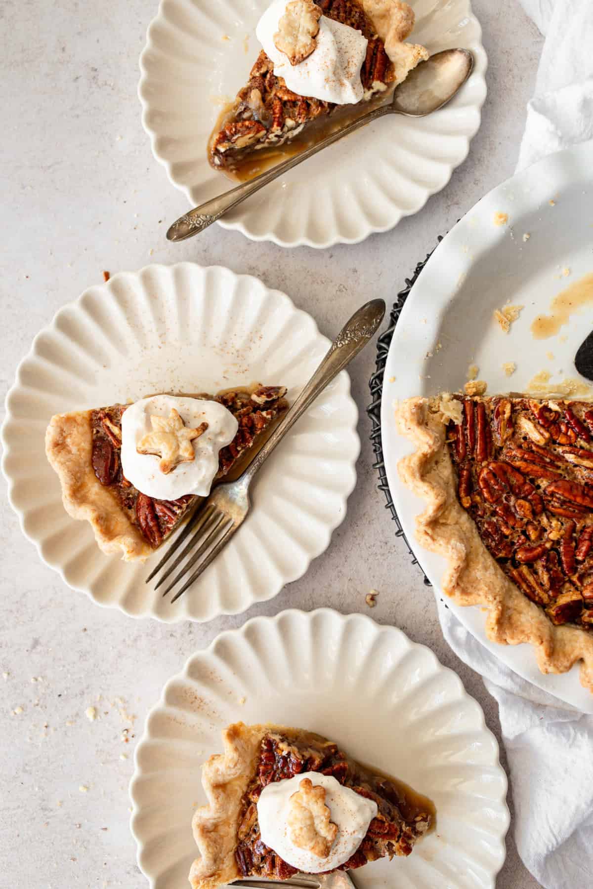 This is the best pecan pie recipe made with a rich, gooey filling with the crunchy, nutty goodness of toasted pecans. It pairs perfectly with a homemade buttery, flaky pie crust. The filling is a sweet blend of brown sugar, eggs, and vanilla, which creates a silky texture that melts in your mouth. You will love this easy pecan pie recipe!