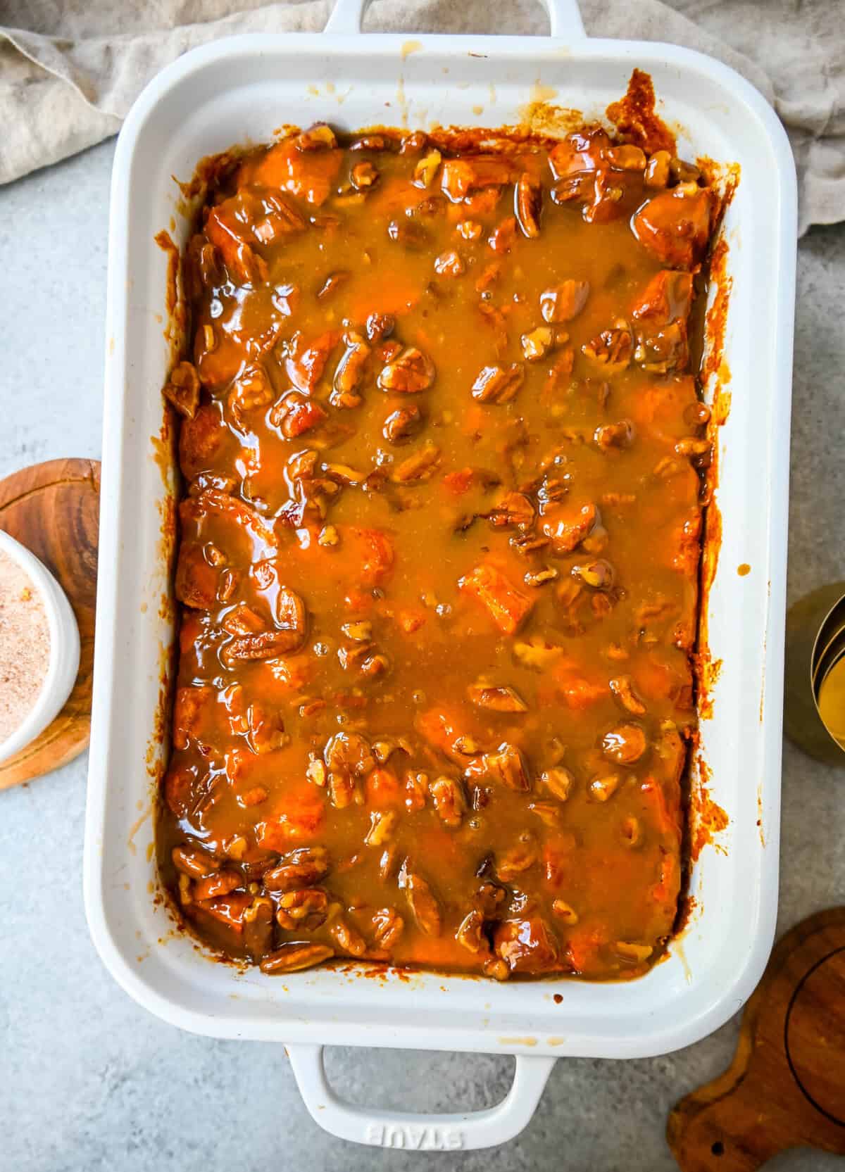 This Pumpkin Praline Bread Pudding is made with brioche bread, homemade pumpkin spice custard and baked until perfectly golden and then topped with a caramel butter pecan sauce. This Pumpkin Bread Pudding with Caramel Pecan Sauce is the perfect Fall comfort food dessert.