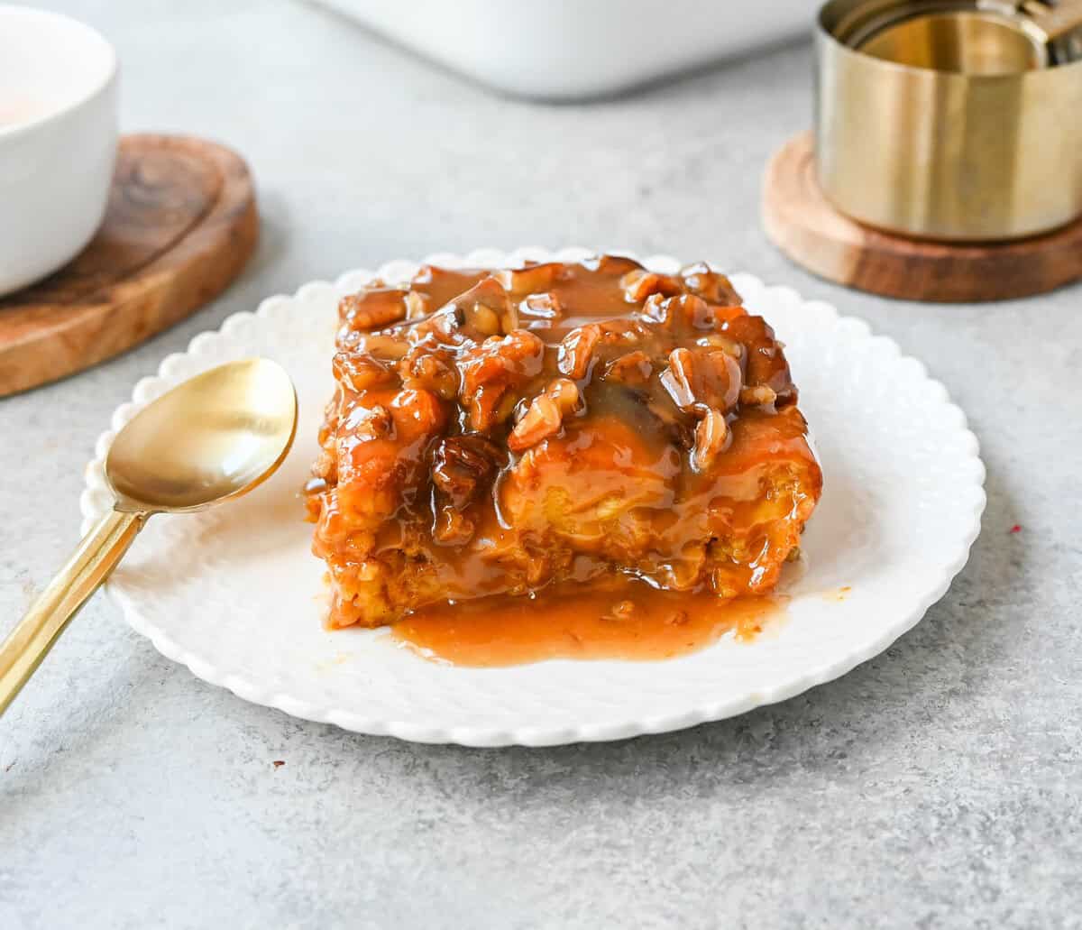 This Pumpkin Praline Bread Pudding is made with brioche bread, homemade pumpkin spice custard and baked until perfectly golden and then topped with a caramel butter pecan sauce. This Pumpkin Bread Pudding with Caramel Pecan Sauce is the perfect Fall comfort food dessert.