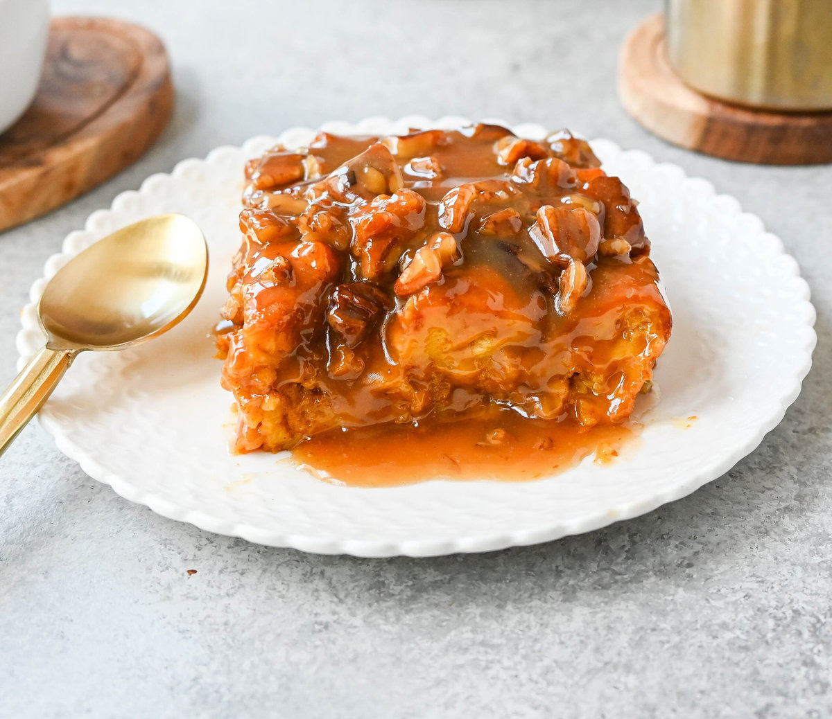 This Pumpkin Praline Bread Pudding is made with brioche bread, homemade pumpkin spice custard and baked until perfectly golden and then topped with a caramel butter pecan sauce. This Pumpkin Bread Pudding with Caramel Pecan Sauce is the perfect Fall comfort food dessert.