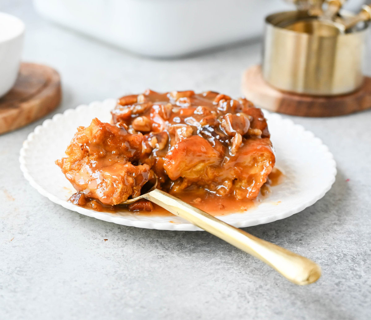 This Pumpkin Praline Bread Pudding is made with brioche bread, homemade pumpkin spice custard and baked until perfectly golden and then topped with a caramel butter pecan sauce. This Pumpkin Bread Pudding with Caramel Pecan Sauce is the perfect Fall comfort food dessert.