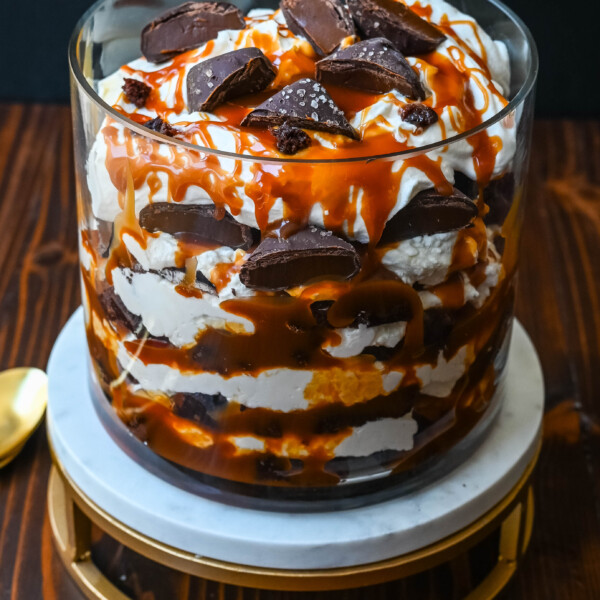 This Salted Caramel Brownie Cheesecake Trifle is made layers of rich, fudgy brownies, creamy cheesecake filling, salted caramel, homemade whipped cream, and chocolate covered caramels. This is the perfect sweet dessert to impress your guests and is such a crowd pleaser!