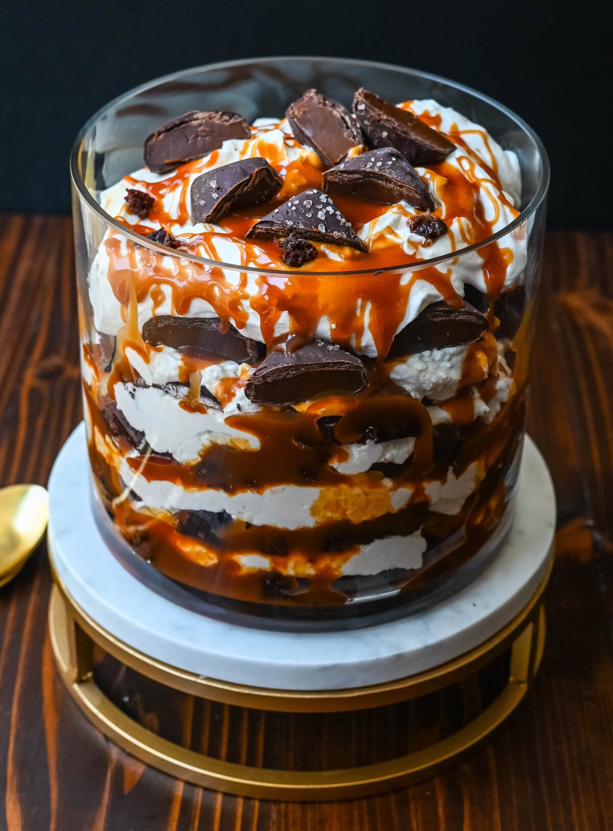 This Salted Caramel Brownie Cheesecake Trifle is made layers of rich, fudgy brownies, creamy cheesecake filling, salted caramel, homemade whipped cream, and chocolate covered caramels. This is the perfect sweet dessert to impress your guests and is such a crowd pleaser!