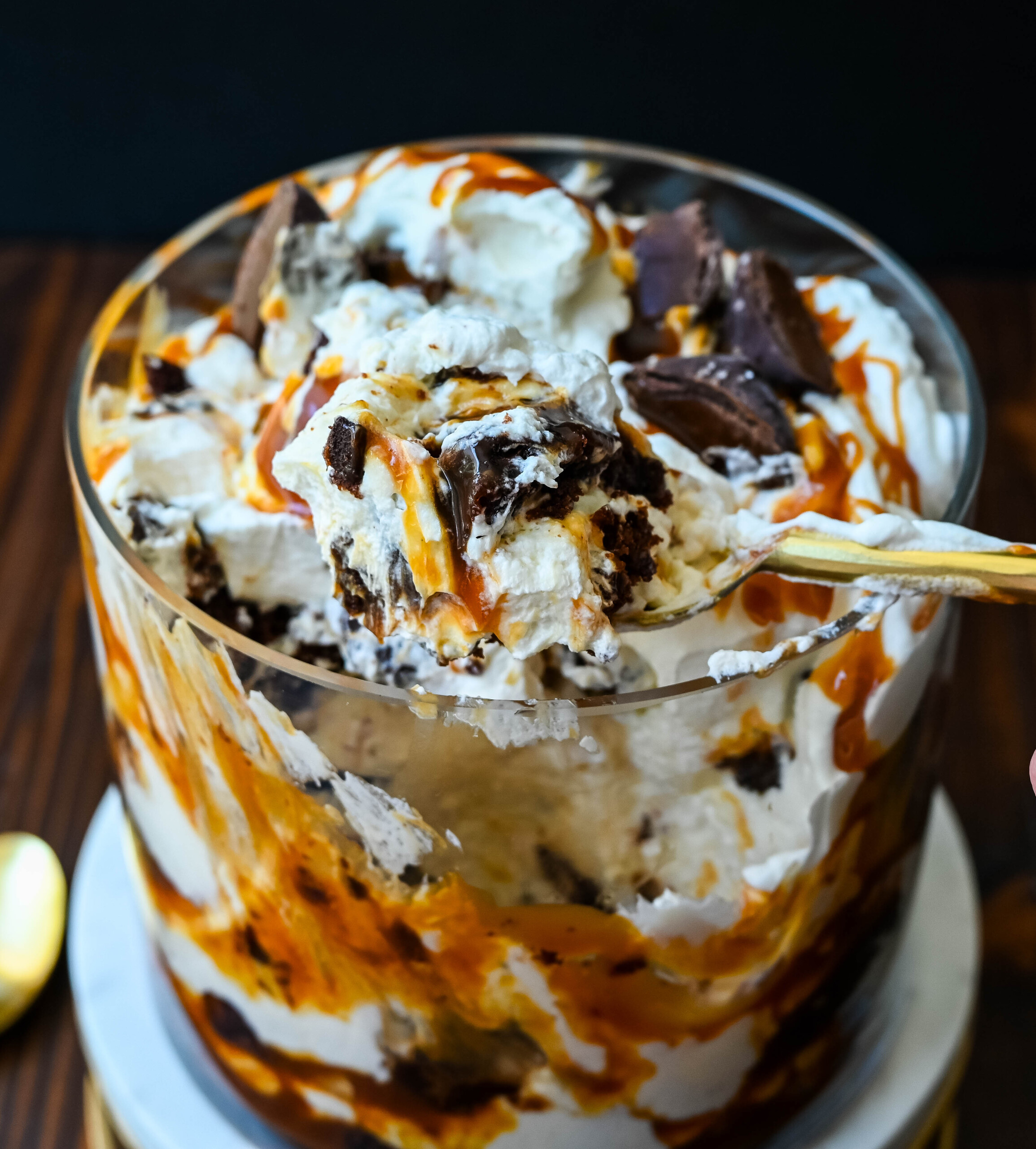 This Salted Caramel Brownie Cheesecake Trifle is made layers of rich, fudgy brownies, creamy cheesecake filling, salted caramel, homemade whipped cream, and chocolate covered caramels. This is the perfect sweet dessert to impress your guests and is such a crowd pleaser!