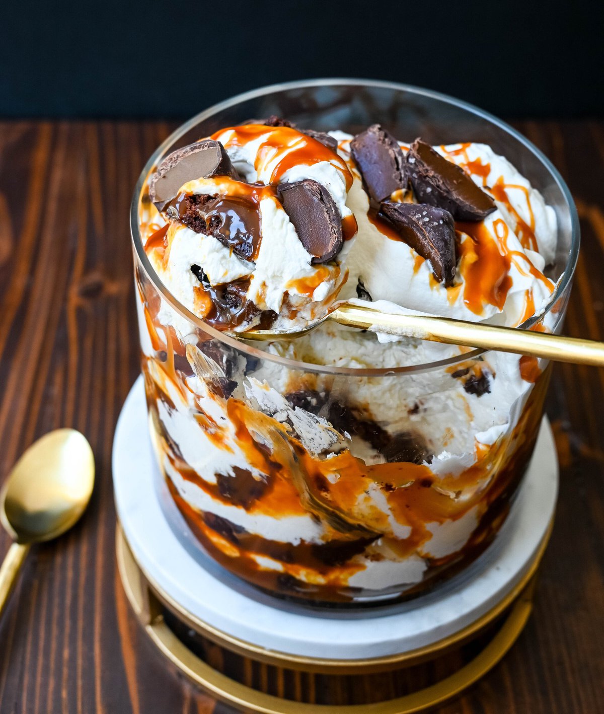 This Salted Caramel Brownie Cheesecake Trifle is made layers of rich, fudgy brownies, creamy cheesecake filling, salted caramel, homemade whipped cream, and chocolate covered caramels. This is the perfect sweet dessert to impress your guests and is such a crowd pleaser!