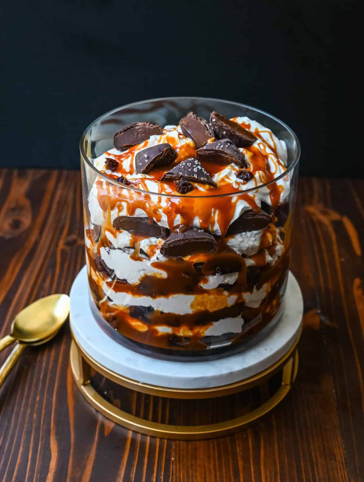 This Salted Caramel Brownie Cheesecake Trifle is made layers of rich, fudgy brownies, creamy cheesecake filling, salted caramel, homemade whipped cream, and chocolate covered caramels. This is the perfect sweet dessert to impress your guests and is such a crowd pleaser!