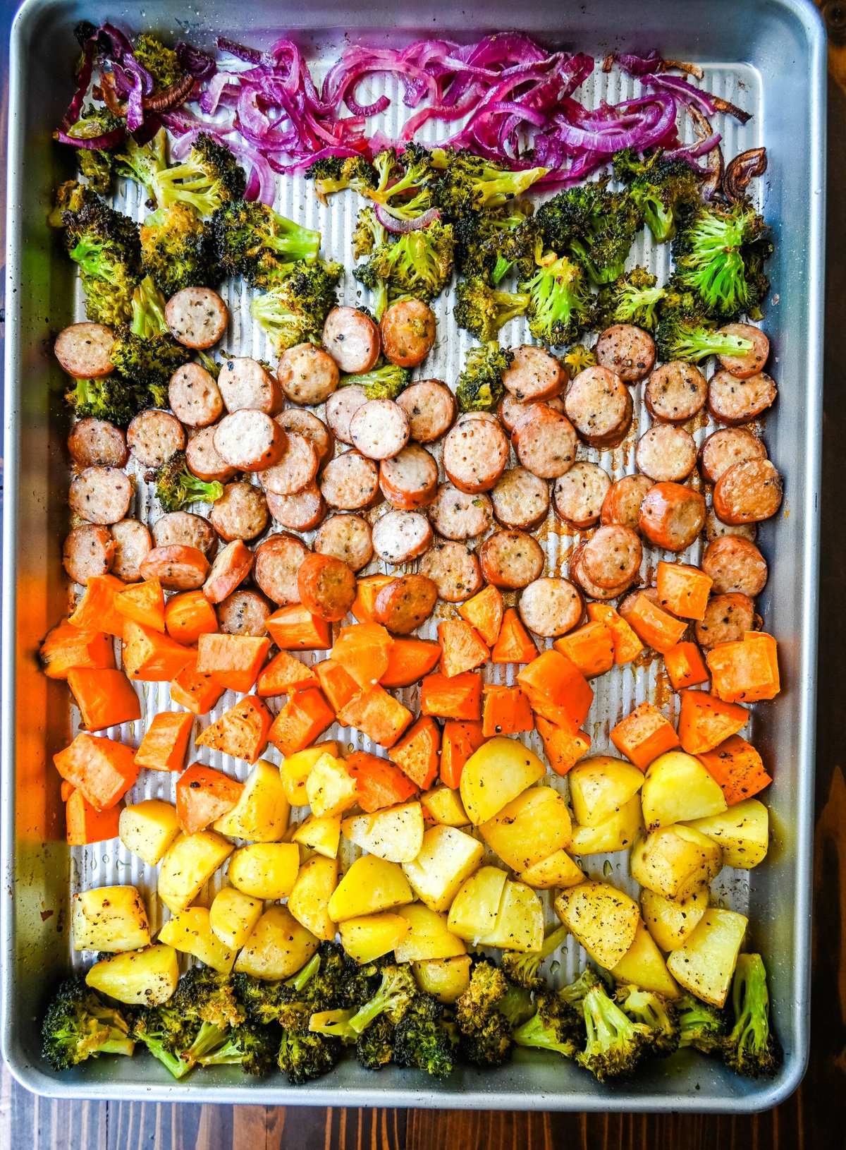 This Sheet Pan Chicken Sausage and Veggies Recipe is made with savory chicken sausage nestled between caramelized, crispy-edged vegetables, all roasted to perfection on a single sheet pan. It's quick, effortless, so delicious, and perfect for busy weeknights or cozy, family-style dinners.