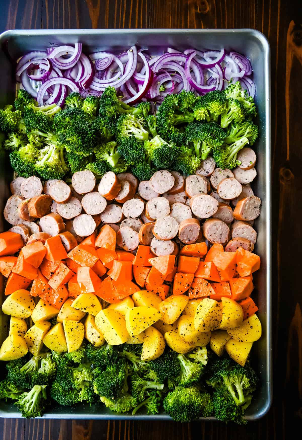 This Sheet Pan Chicken Sausage and Veggies Recipe is made with savory chicken sausage nestled between caramelized, crispy-edged vegetables, all roasted to perfection on a single sheet pan. It's quick, effortless, so delicious, and perfect for busy weeknights or cozy, family-style dinners.