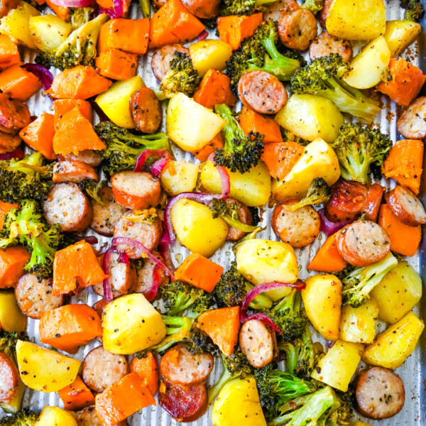 This Sheet Pan Chicken Sausage and Veggies Recipe is made with savory chicken sausage nestled between caramelized, crispy-edged vegetables, all roasted to perfection on a single sheet pan. It's quick, effortless, so delicious, and perfect for busy weeknights or cozy, family-style dinners.