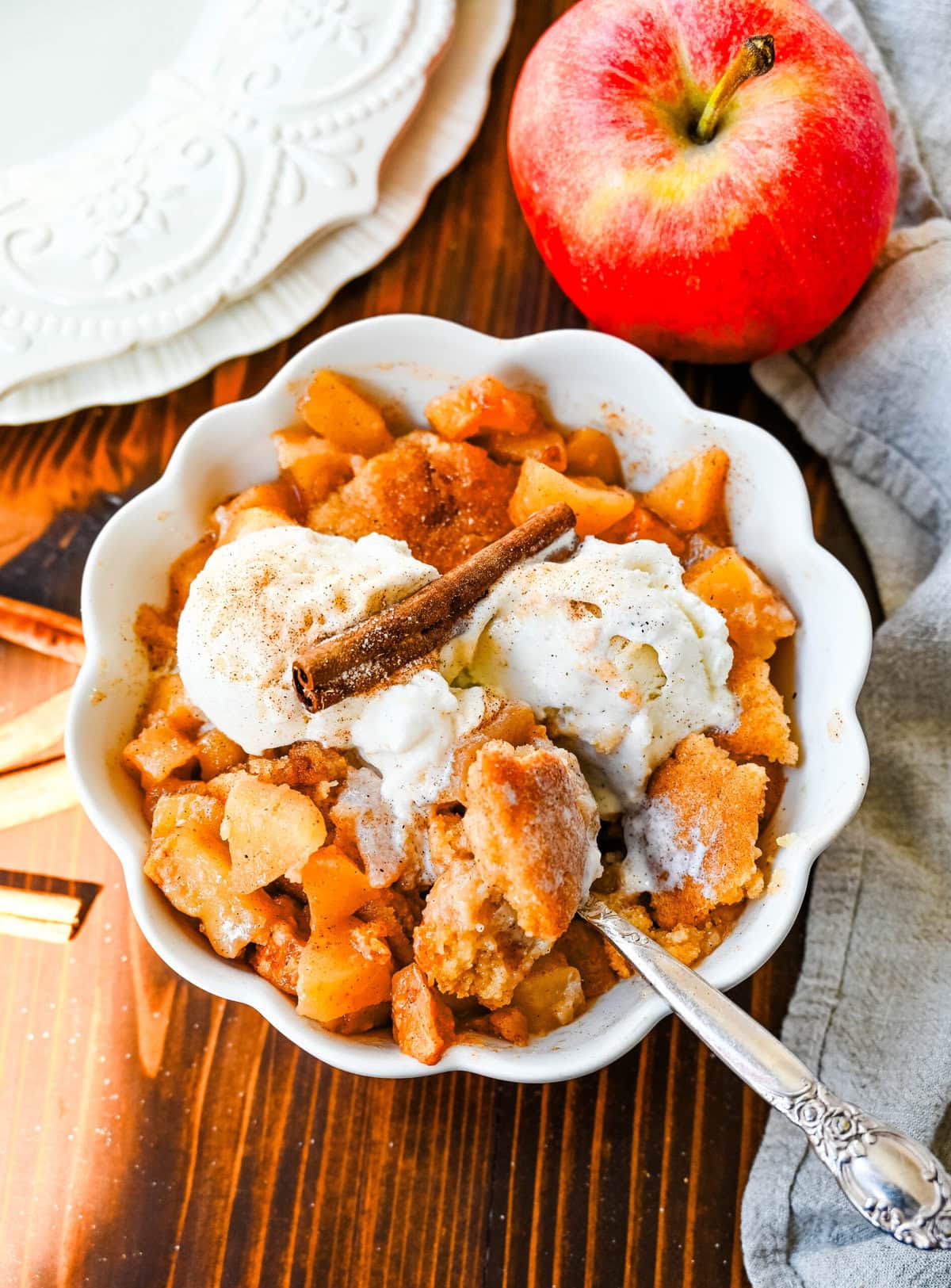 This Apple Cobbler recipe is made with fresh apples sauteed with butter, cinnamon, brown sugar, and apple cider and then baked with the most perfect topping that is sweet, crisp, and pairs perfectly with the fresh apples. This is the best apple cobbler recipe!