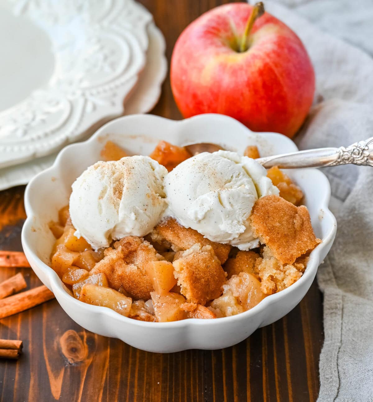 This Apple Cobbler recipe is made with fresh apples sauteed with butter, cinnamon, brown sugar, and apple cider and then baked with the most perfect topping that is sweet, crisp, and pairs perfectly with the fresh apples. This is the best apple cobbler recipe!