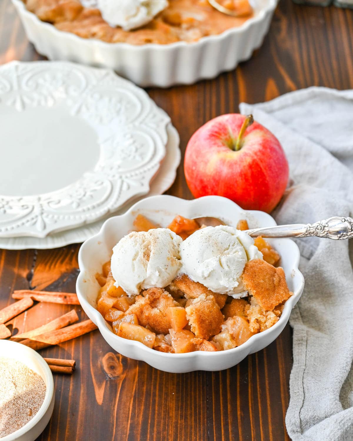 This Apple Cobbler recipe is made with fresh apples sauteed with butter, cinnamon, brown sugar, and apple cider and then baked with the most perfect topping that is sweet, crisp, and pairs perfectly with the fresh apples. This is the best apple cobbler recipe!